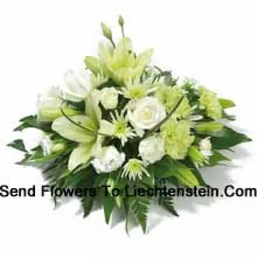 A Beautiful Arrangement Of White Roses, White Carnations, White Lilies And Assorted White Flowers With Seasonal Fillers